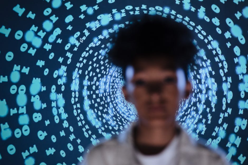 Blurred person in front of a digital code projection creating a tech-inspired abstract vibe
